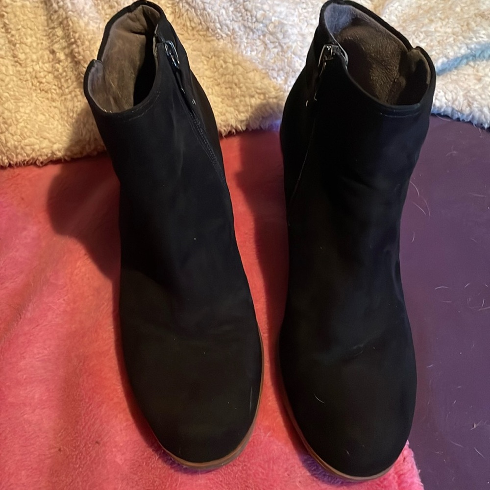 Ankle black boots , has zipper on inside and a cute buckle for looks ,